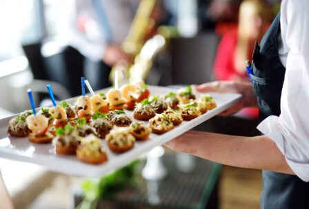 Waiter,Carrying,Plates,With,Meat,Dish,On,Some,Festive,Event,